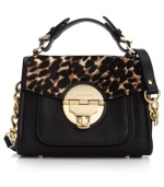 Master mixed media accessorizing with this chic satchel from MICHAEL Michael Kors. Signature golden hardware adorn the sumptuous leather accented with leopard haircalf trim, making this silhouette effortlessly exotic.