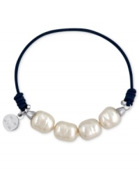 Majorica explores its whimsical side with this bracelet. Organic man-made pearls (8 mm) adorn a navy-blue elastic cord for a fun and fashionable look. Approximate length: 6-1/2 inches.