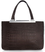 Accentuate your allure for the exotic with this MICHAEL Michael Kors silhouette in croc- or lizard-embossed leather. Gleaming custom hardware complements the classic carryall design that features an ultra-spacious interior. Carry it day or night for added edge to any outfit.