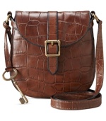 Give in to your animal instincts with this croc-embossed leather bag from Fossil, featuring brasstone hardware and signature detailing. Convenient crossbody strap keeps hands free for easy access to pockets and compartments within.