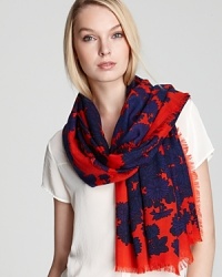 Take the floral trend into cold-weather months with this red MARC BY MARC JACOBS scarf, printed with dark blue flowers.