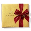 A classic assortment of Belgian chocolates from Godiva comes in a beautiful gold box tied with big red bow and holiday pick. Each ballotin includes Godiva signature favorite ganaches, pralines, caramels, fruits and nuts in milk, dark and white chocolate.