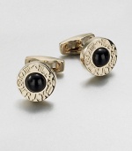 Round gold-tone cuff links with onyx center and engraved zodiac sign motif.Brass/onyxAbout ¾ diam.Made in Italy