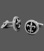 For a royally distinguished look. The symbolic Fleur De Lis adorns this sophisticated pair of cuff links. Crafted in titanium and black enamel. Approximate diameter: 5/8 inch.