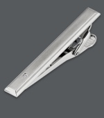 Organize your look. Keep your favorite tie in place while adding a little polish with this sleek tie bar. Crafted in stainless steel with a sparkling diamond accent. Tension backing helps keep ties secure. Approximate length: 2-1/8 inches. Approximate width: 1-4/10 inches.