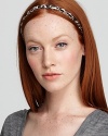 Finish your head-to-toe look with this stylish Juicy Couture headband that mixes the exotics trend with glints of metal.