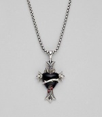 A bleeding heart of black onyx, in a lavish medieval setting of sterling silver, is accented with two tiny garnet drops and hangs from a silver box chain. Black onyx and garnet Sterling silver Chain length, about 20 Pendant length, about 1½ Lobster clasp Imported