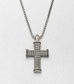 Black diamonds outline this exquisite cross pendant of sterling silver, suspended from a box chain necklace.Sterling silverBlack diamondLength, about 22Imported