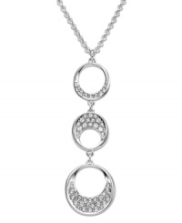 Modern and sophisticated, this pendant offers a beautiful interpretation of a timeless circle motif. Swarovski's fluid design complements a wide variety of outfits. Hanging on a rhodium-plated mixed metal chain, three circular elements are sprinkled with clear crystal pavé for extra sparkle. Approximate length: 15 inches + 2-inch extender. Approximate drop: 1 inches.