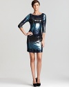 Splashed with sequins and dripping with color, this Karen Kane dress lends fluid dimension to your cocktail look. Team with metallic accents and plunge to dramatic style depths.