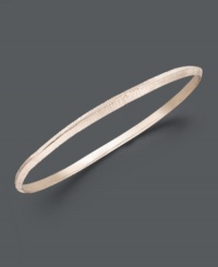 Capture the latest style of stacking! Studio Silver's intricate, etched bangle slips easily over the wrist and can be worn solo or paired with other stackable styles for a look that's trendy and stylish. Crafted in 18k rose gold over sterling silver. Approximate diameter: 2-5/16 inches.