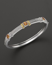 Detailed in 18K yellow gold, Judith Ripka's sterling silver and honey corundum bangle lends a timelessly luxe look.