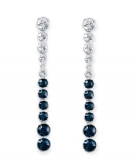 Revel in utter elegance. Swarovski's Hot Montana drop earrings feature icy round-cut clear and Montana blue crystals in a silver tone mixed metal setting. Approximate drop: 3 inches.