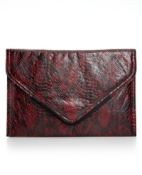 Show some skin with this exotic envelope clutch from BCBGeneration that adds something chic to your evening out. Python print plays elegantly against the slim silhouette that stows keys, cards, cash and ID.