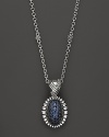 Shining blue sapphires are trimmed in fluted sterling silver on this Lagos pendant necklace.