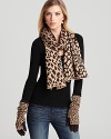 Keep your cold weather style young, wild and free in this leopard-print, oblong scarf from Aqua.