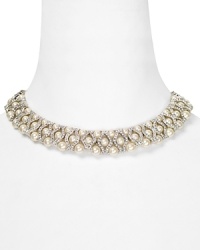 Feeling prim and proper? Accessorize a polished mood with this Carolee necklace, which features a strand of glass pearls detailed by a crystal closure.