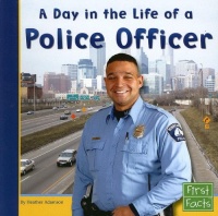 A Day in the Life of a Police Officer (First Facts: Community Helpers at Work)