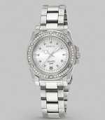 This sturdy yet feminine timepiece features a bezel of sparkling Swarovski crystals.Swiss quartz movement Water resistant to 10 ATM Swarovski crystal bezel Round stainless steel case, 34mm, (1.33) Date display at 6 o'clock Second hand Stainless steel link bracelet Safety lock closure Imported