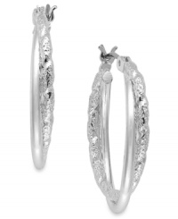 Twists and turns add suspenseful appeal to these earrings from Charter Club. The classic hoop has been embellished with crystal shimmer. Crafted in silver tone mixed metal. Approximate drop: 9/10 inch.