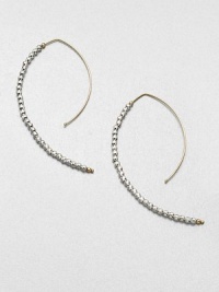 Delicate faceted sterling silver beads line up along the golden arc of an artfully shaped hoop with a modern appeal.14k yellow gold and sterling silverLength, about 2Hoop wireMade in USA