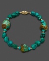 Gorgeously rough around the edges. Turquoise chips (6-7 mm) align for a naturally beautiful effect in this bracelet crafted in 14k gold. Approximate length: 7-1/2 inches.