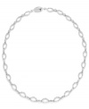 Shape up with a little shimmer. Eliot Danori's intricate oval link necklace glistens with the addition of round-cut crystals. Set in silver tone mixed metal. Approximate length: 16 inches.