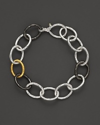 New developments in elegance. Links in hammered 24 Kt. yellow gold, dark and light silver set Gurhan's hoopla bracelet apart.