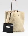 Super-soft and so luxurious, this shearling style comes with a detachable coin pouch for easy access to your smaller essentials.Double leather shoulder straps, 10 dropOpen topDetachable coin pouch13W X 15¾H X 6DMade in Italy