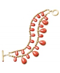 Infuse your style with tropical hues. Lauren by Ralph Lauren's vibrant two-row bracelet features teardop-shaped reconstituted coral beads set in gold tone mixed metal. Approximate length: 7-1/2 inches.