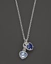 A twin heart necklace in blue quartz and blue corundum framed in sterling silver. Designed by Judith Ripka.