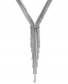 Meeting in the middle makes for an elegant look in this necklace from BCBGeneration. Crafted from silver-tone mixed metal, the chains come together and end in a stylish tassel. Approximate length: 19 inches. Approximate drop: 7 inches.