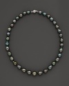 Darkly shimmering Tahitian pearls with 14K. white gold.