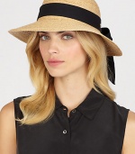 Fine braided raffia accented with polka dot ribbon trim can be worn with brim turned up or rolled down. Bow at back Adjustable sizing cord Brim, about 3½ Imported