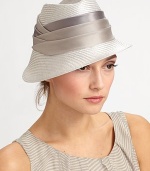 Sophisticated asymmetric design with pleated silk band.StrawWide silk bandGraduated brim from 1¼ to 3Spot cleanMade in Italy