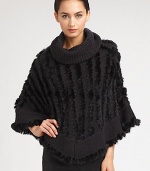 A sophisticated style with luxurious dyed rabbit fur accenting a warm knitted design. Oversized turtleneckCurved hemAbout 35 from shoulder to hem70% acrylic/30% woolSpecialist dry cleanImportedFur origin: China 