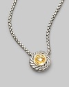 From the Color Classic Collection. A swirled sterling silver cookie pendant, with a faceted center of glowing citrine, on a bold box chain. Citrine Sterling silver Chain length, about 16 Pendant diameter, about ½ Lobster clasp Imported