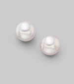 From the Akoya Collection. Classic white cultured pearl studs set in 18k gold. 7mm white round cultured pearls Quality: A 18k white gold Post back Imported