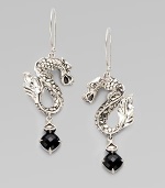 From the Naga Collection. Slightly ferocious but oh so stylish, these S-shaped dragons hold faceted drops of black chalcedony.Black chalcedonySterling silverDrop, about 2¼Ear wireImported