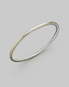 From the Cable Bangle collection. A smooth 18k gold exterior meets a cabled sterling silver interior on this truly unique bracelet. 18k yellow gold Sterling silver Diameter, about 2½ Imported