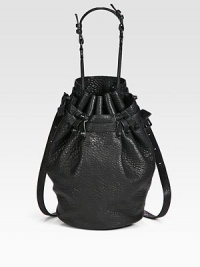 Gorgeous pebble-grain leather in a roomy drawstring bucket silhouette finished with chic matte hardware and dual strap options.Top handle, 8¼ dropDetachable adjustable crossbody strap, 14½-20¼ dropDrawstring closureOne outside open pocketProtective metal feetOne inside zip pocketTwo inner compartmentsFully lined11½W X 8H X 5DImported