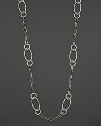 Beautifully textured sterling silver links, in oval and circle shapes, form a dramatic necklace. From the John Hardy Bedeg collection.