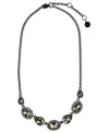 Embrace elegance. This statement necklace from Givenchy is crafted from hematite-tone mixed metal with glass stones and cubic zirconia accents adding a touch of luster. Approximate length: 16 inches + 2-inch extender.