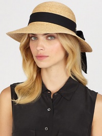 Fine braided raffia accented with polka dot ribbon trim can be worn with brim turned up or rolled down. Bow at back Adjustable sizing cord Brim, about 3½ Imported