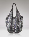 This snake motif enters covet-worthy terrain with this slouchy leather tote from Kooba. It features a shoulder-right shape accented with practical pockets for the essentials.