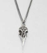 A small raven skull pendant highlights impeccable carving and attention to detail from a sterling silver curb link chain necklace.Sterling silverLength about 24Lobster claspMade in USA