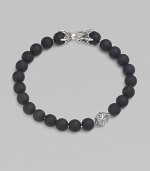 A striking collection of onyx beads are laced alongside a sterling silver accent and matching closure. From the Spiritual Bead Collection 8mm onyx beads Sterling silver Bracelet length, about 8½ Sterling silver clasp Imported 