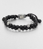 From the Spirited Bead Collection, this two-row beaded bracelet is handsomely crafted from 6mm black onyx beads, featuring three sterling silver cable beads and an adjustable clasp.Sterling silverBlack onyxAbout 9 longAbout 3 diam.Imported