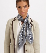 A charming floral print and zig-zag fringe add unique style to a wool scarf.WoolAbout 45 X 45Dry cleanImported