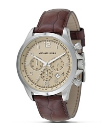 MICHAEL Michael Kors times it right with a tan chronograph watch. The dial features a date window, logo and numeral indices and sweep second hand. With brown croco-embossed strap.